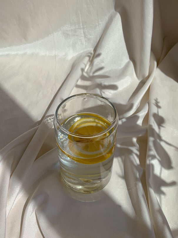 Clear Drinking Glass With Lemon in Water